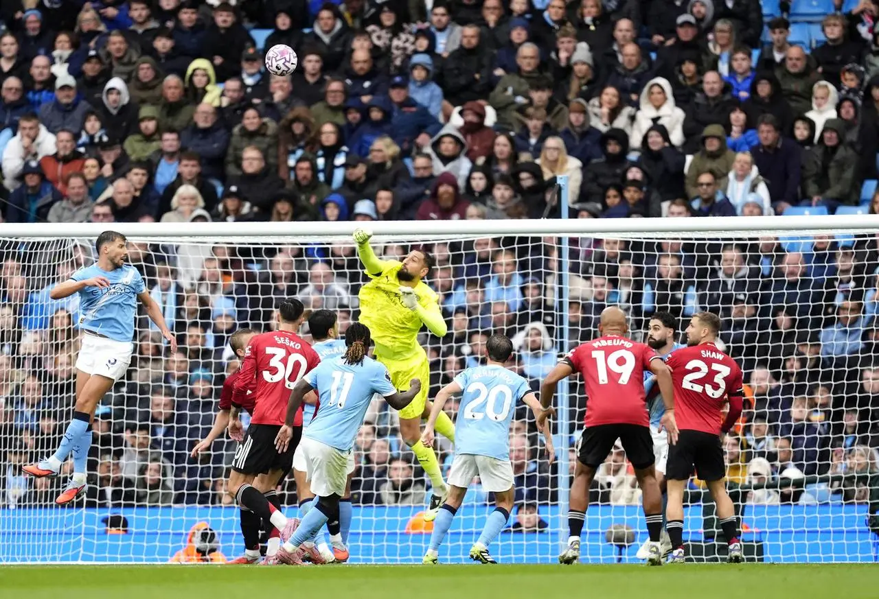 Manchester City goalkeeper Gianluigi Donnarumma punches clear
