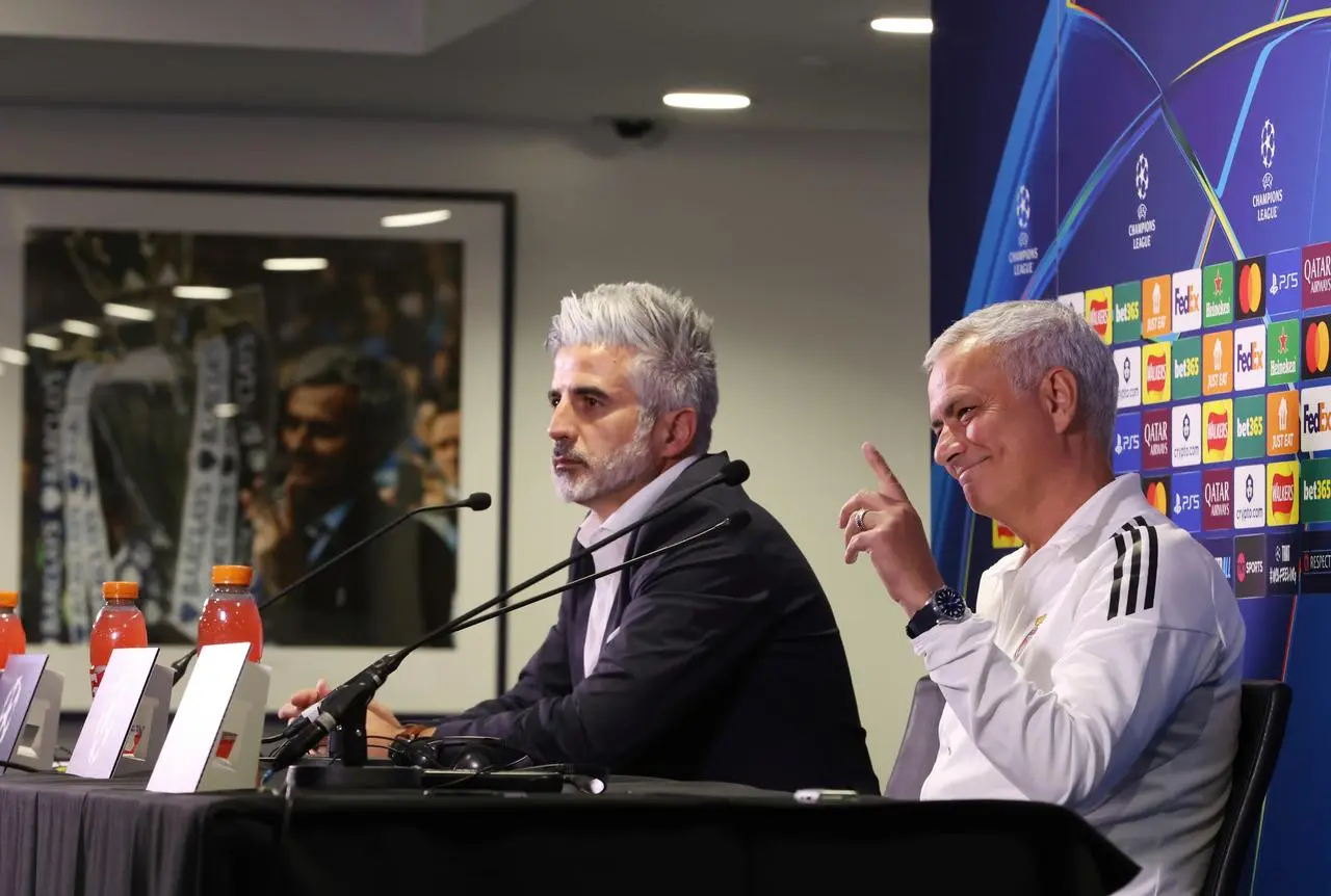 Mourinho, next to an image on the wall of him as Chelsea manager, during a press conference at Stamford Bridge