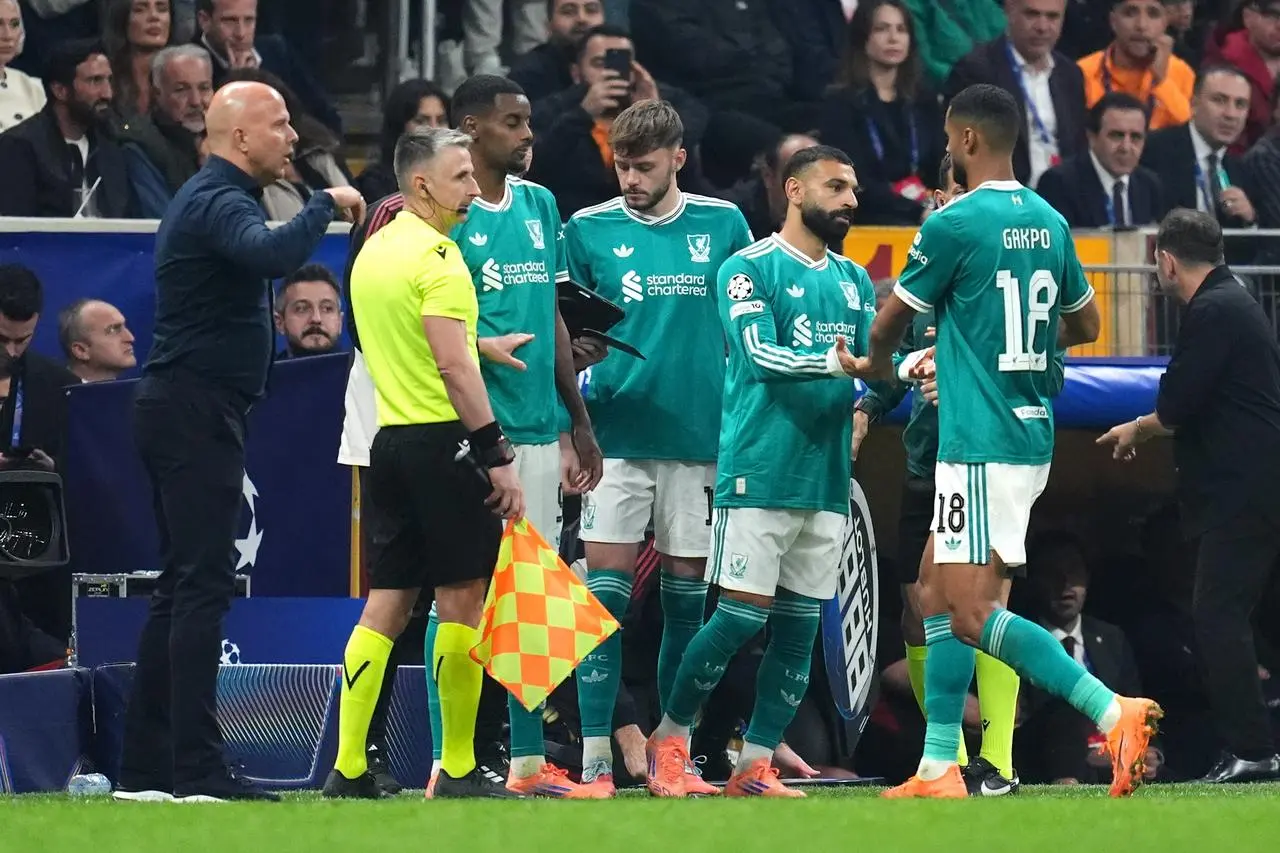 Liverpool’s Mohamed Salah (second right) is substituted on for team-mate Cody Gakpo