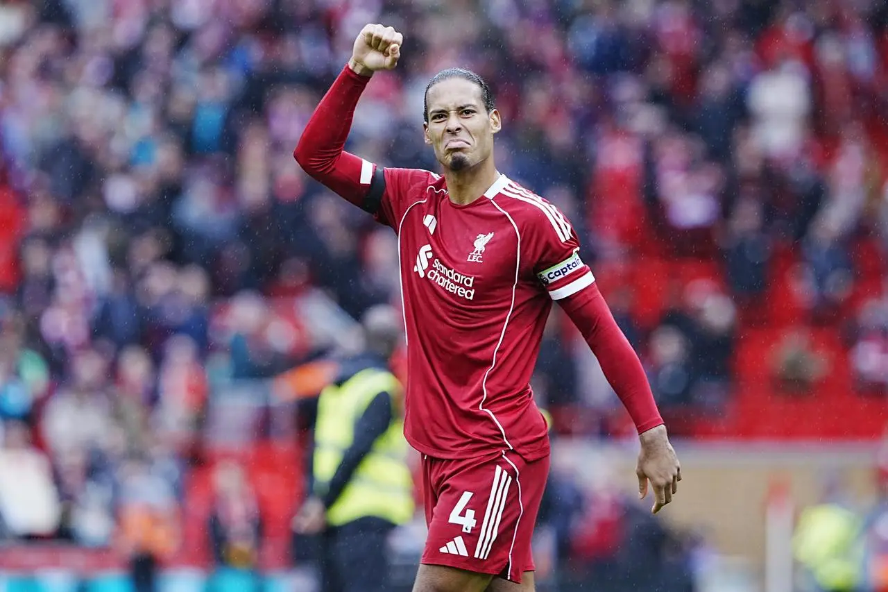 Liverpool's Virgil van Dijk raises his right fist in celebration