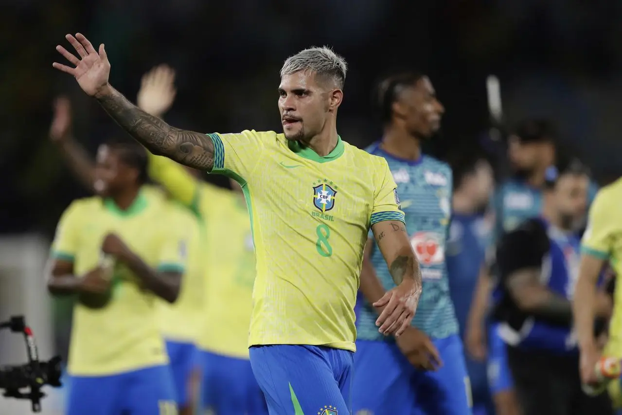 Brazil’s players celebrate winning 3-0 against Chile