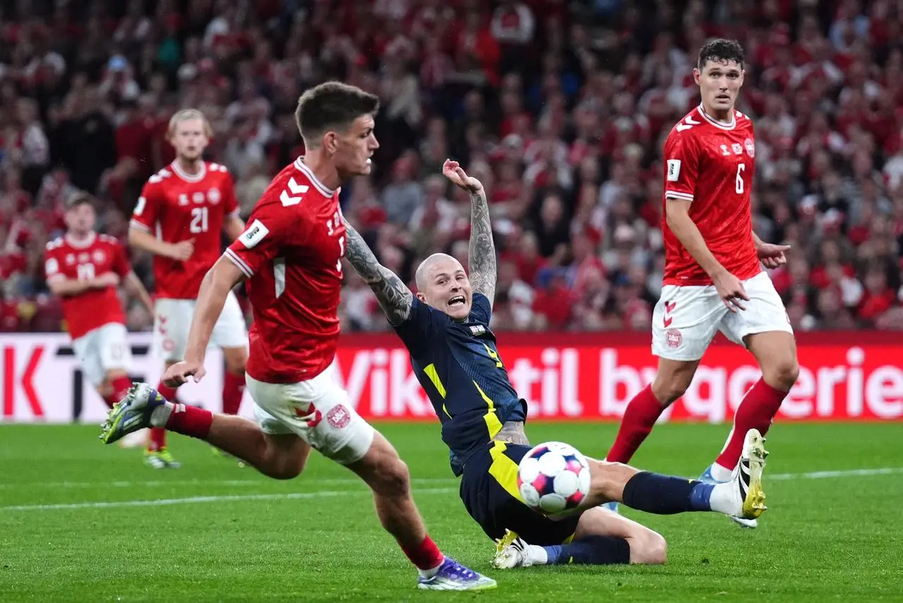 Scotland’s Lyndon Dykes fails to intercept a cross against Denmark