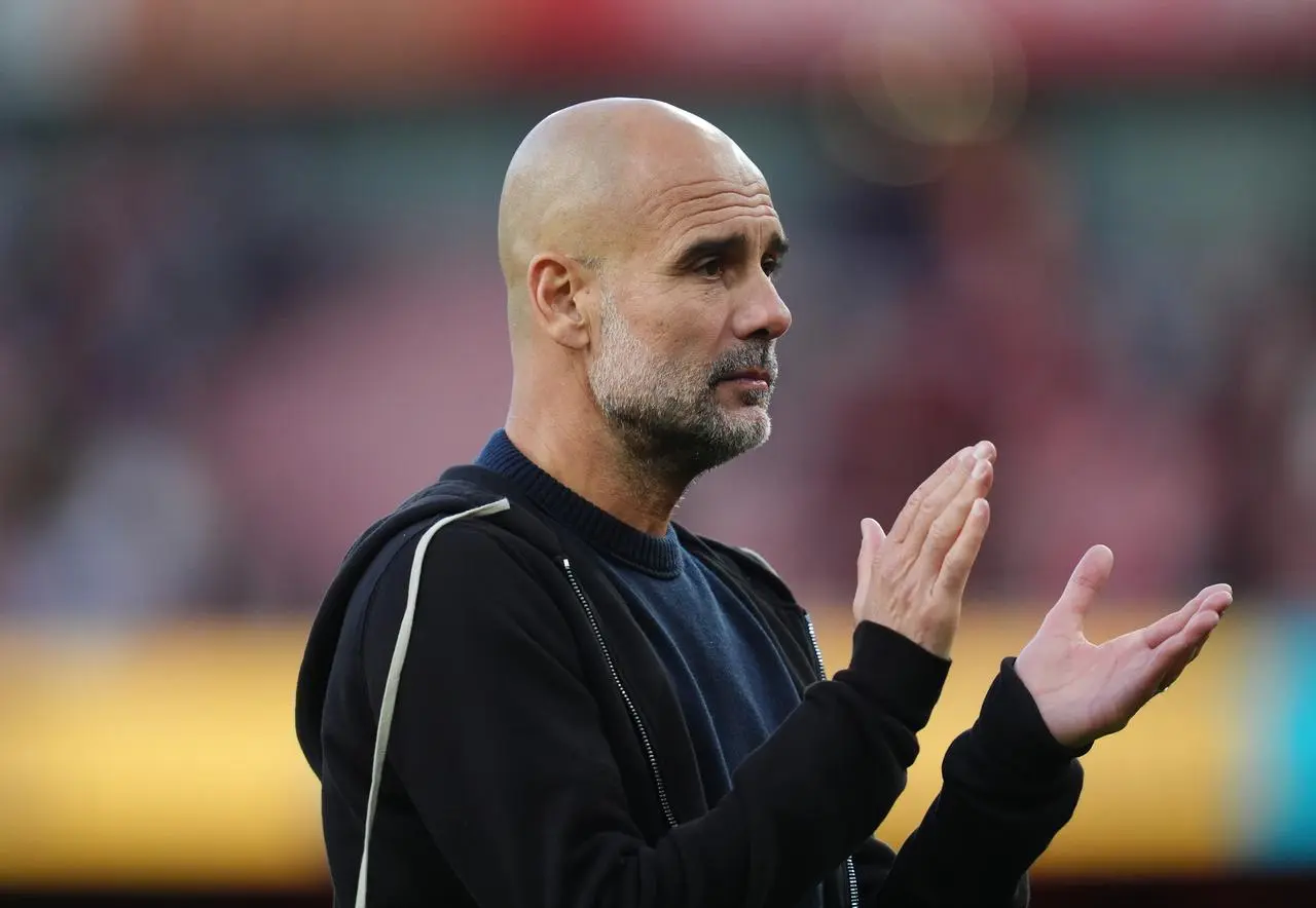 Pep Guardiola applauds after the draw with Arsenal 