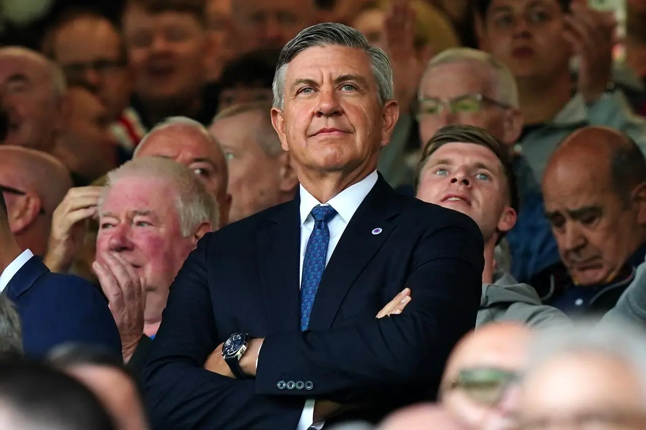 Rangers chairman Andrew Cavenagh stands with his arms folded