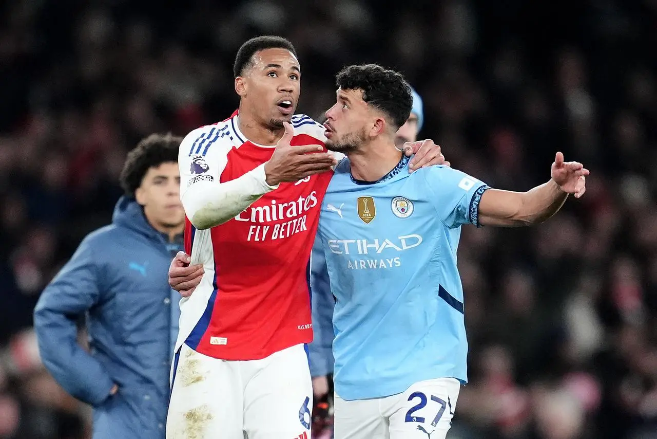 Arsenal’s Gabriel (left) and Manchester City’s Matheus Nunes have an animated discussion