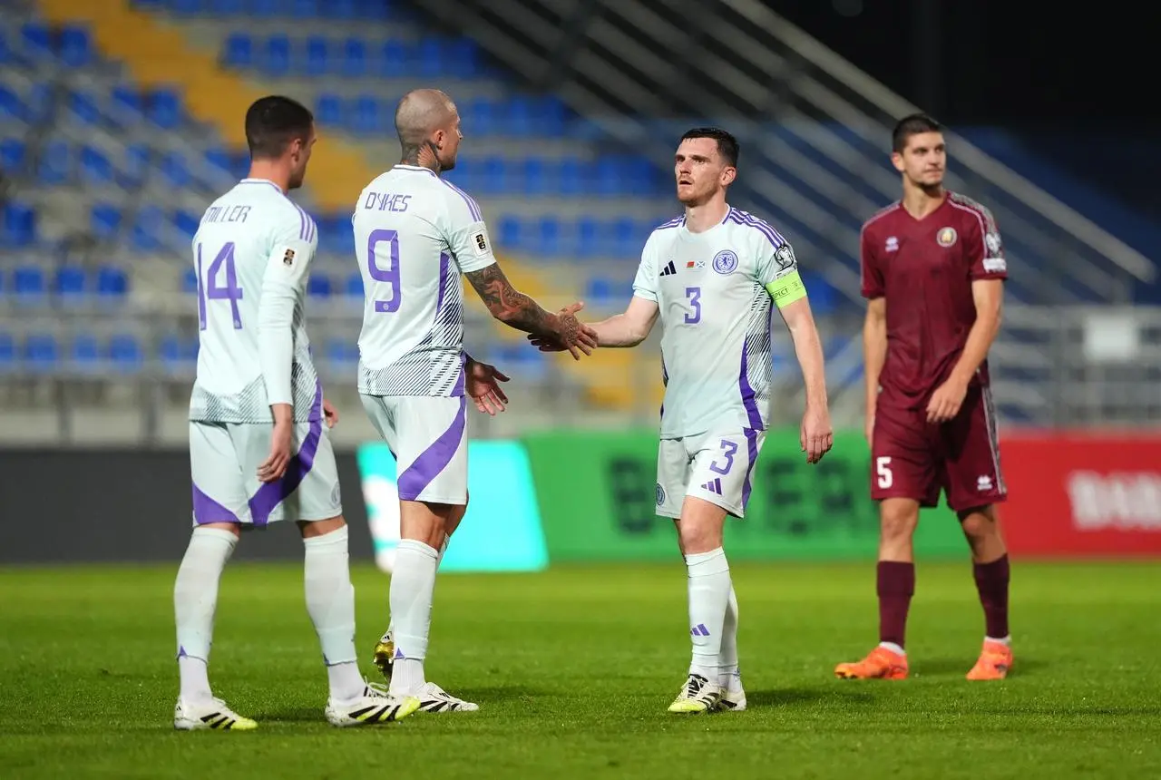 Lyndon Dykes greets Scotland captain Andy Robertson (right) following the World Cup qualifying match against Belarus in Zalaegerszeg, Hungary.