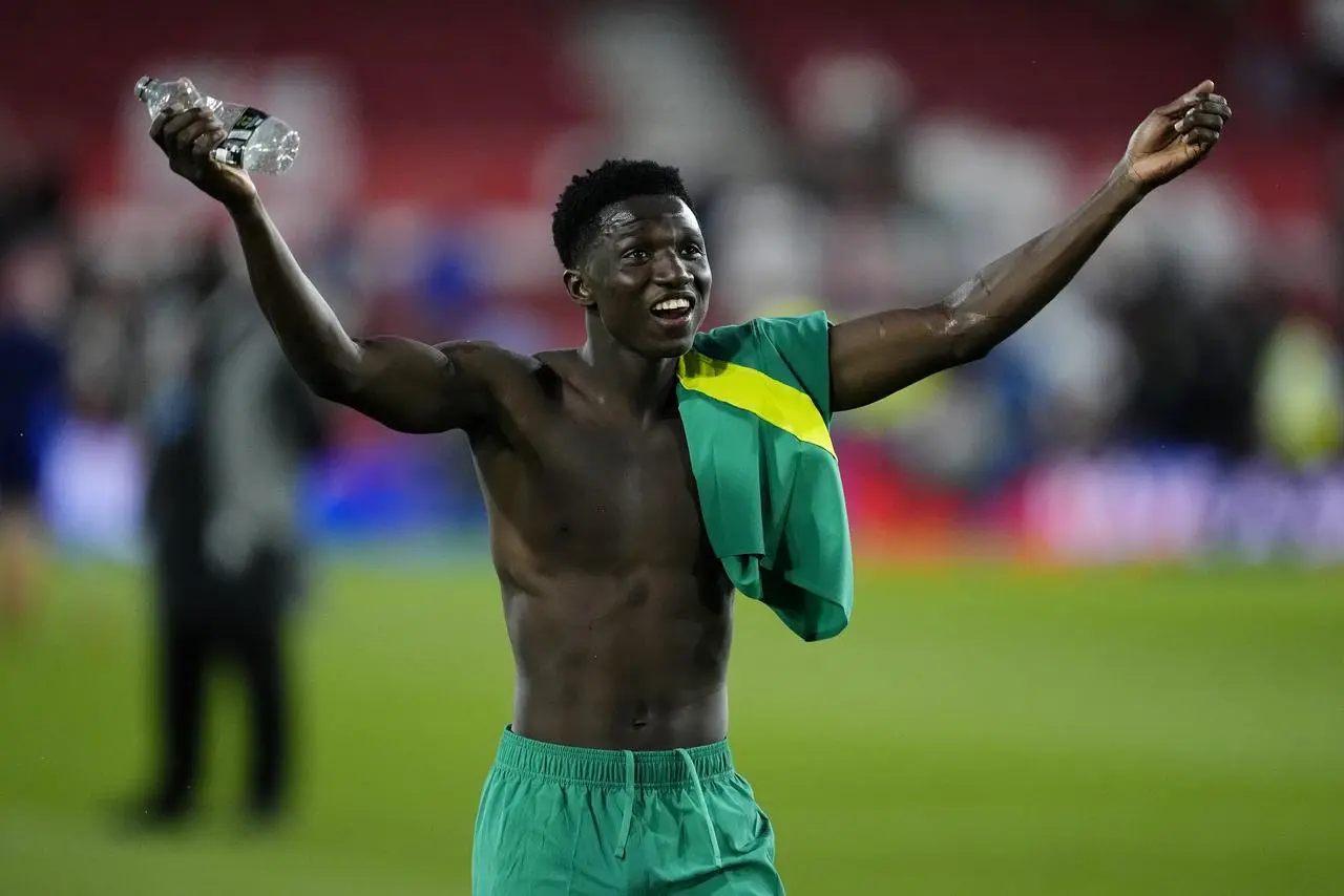 Senegal’s Lamine Camara celebrates the win over England