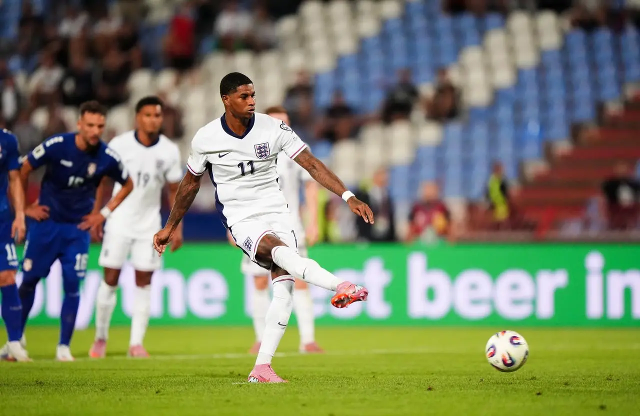 England’s Marcus Rashford scores his penalty against Serbia