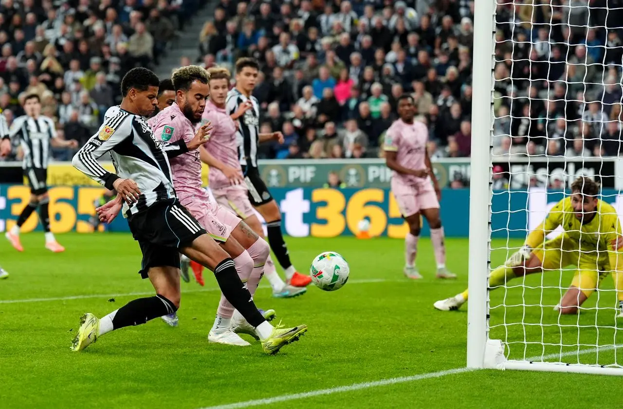 Newcastle's William Osula scores close to the post