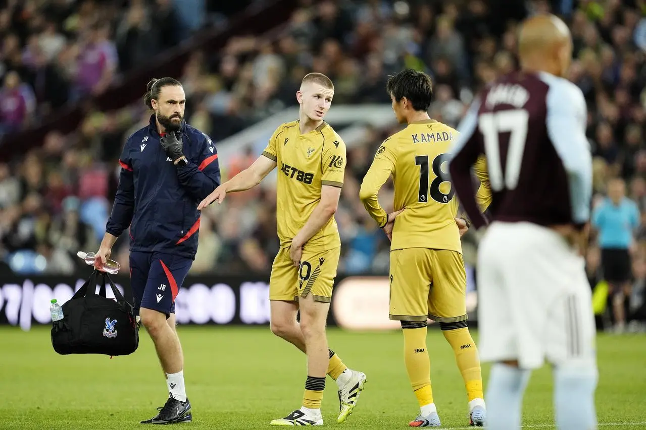 Crystal Palace’s Adam Wharton leaves the pitch injured during a game at Aston Villa