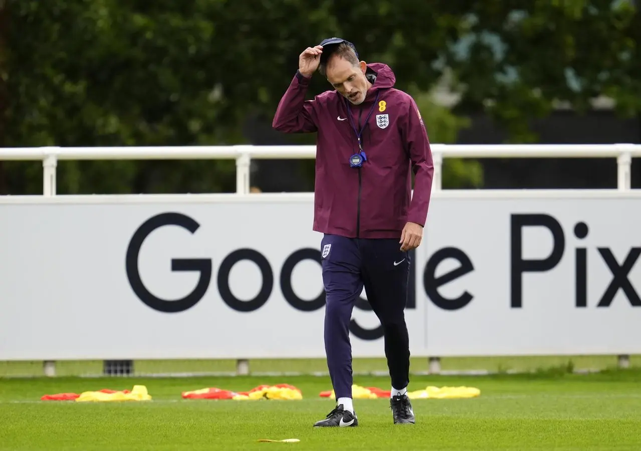 England head coach Thomas Tuchel lifts off his cap during a training session
