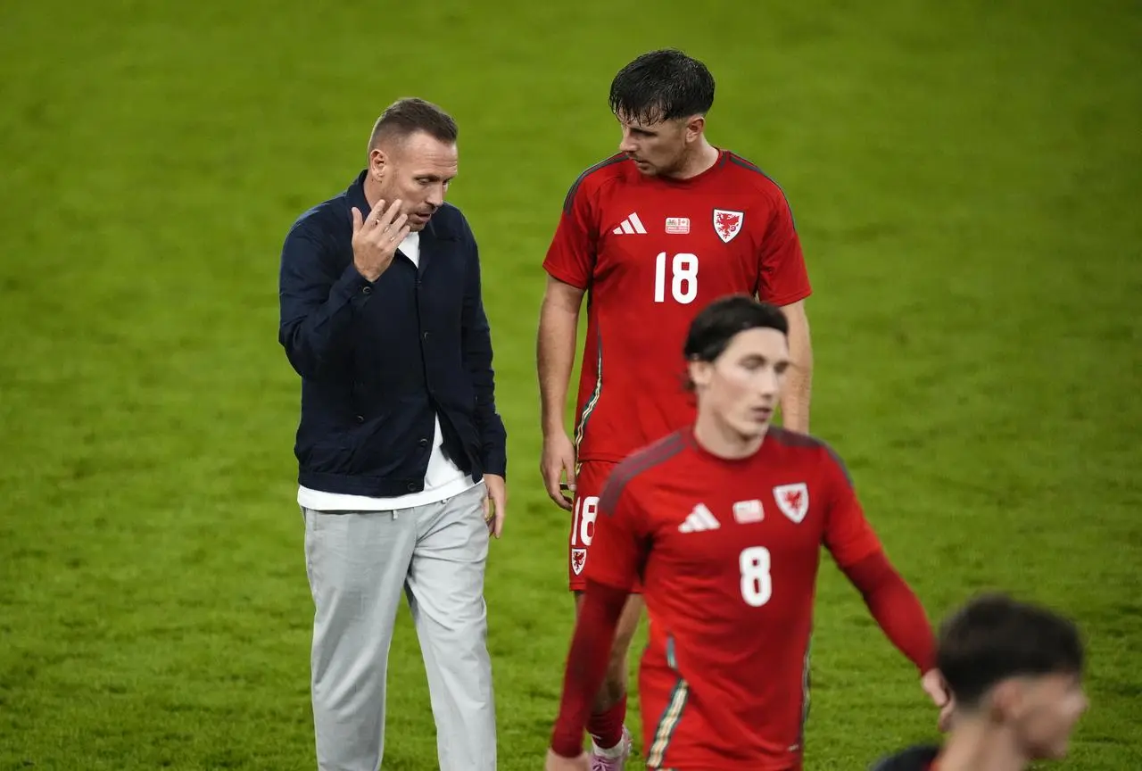 Wales manager Craig Bellamy talks to Mark Harris following an international friendly match at Swansea.com Stadium.