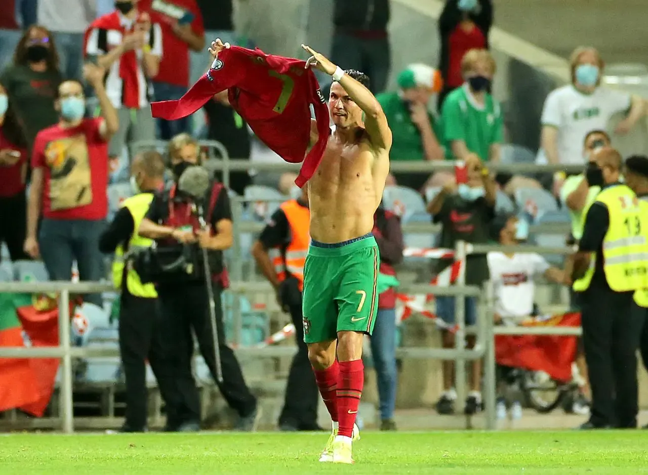 Portugal’s Cristiano Ronaldo holds up his shirt to to the fans after scoring his second goal against the Republic of Ireland in September 2021