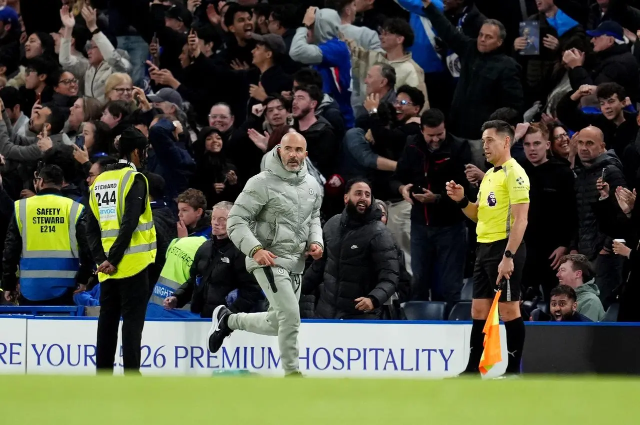 Chelsea manager Enzo Maresca runs back to the bench before receiving a red card
