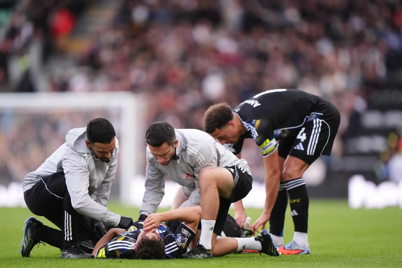 Daniel James receives treatment during Leeds' game against Fulham