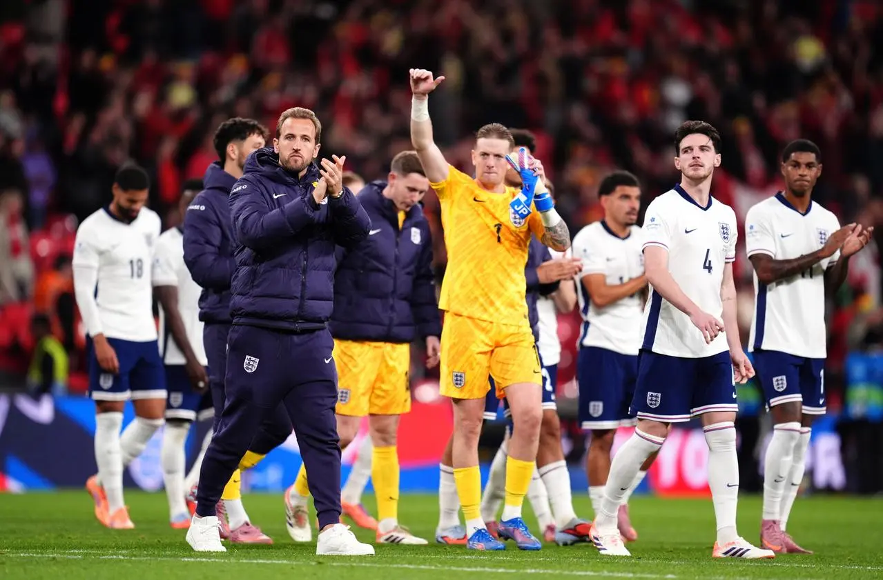 England players celebrate on the pitch 