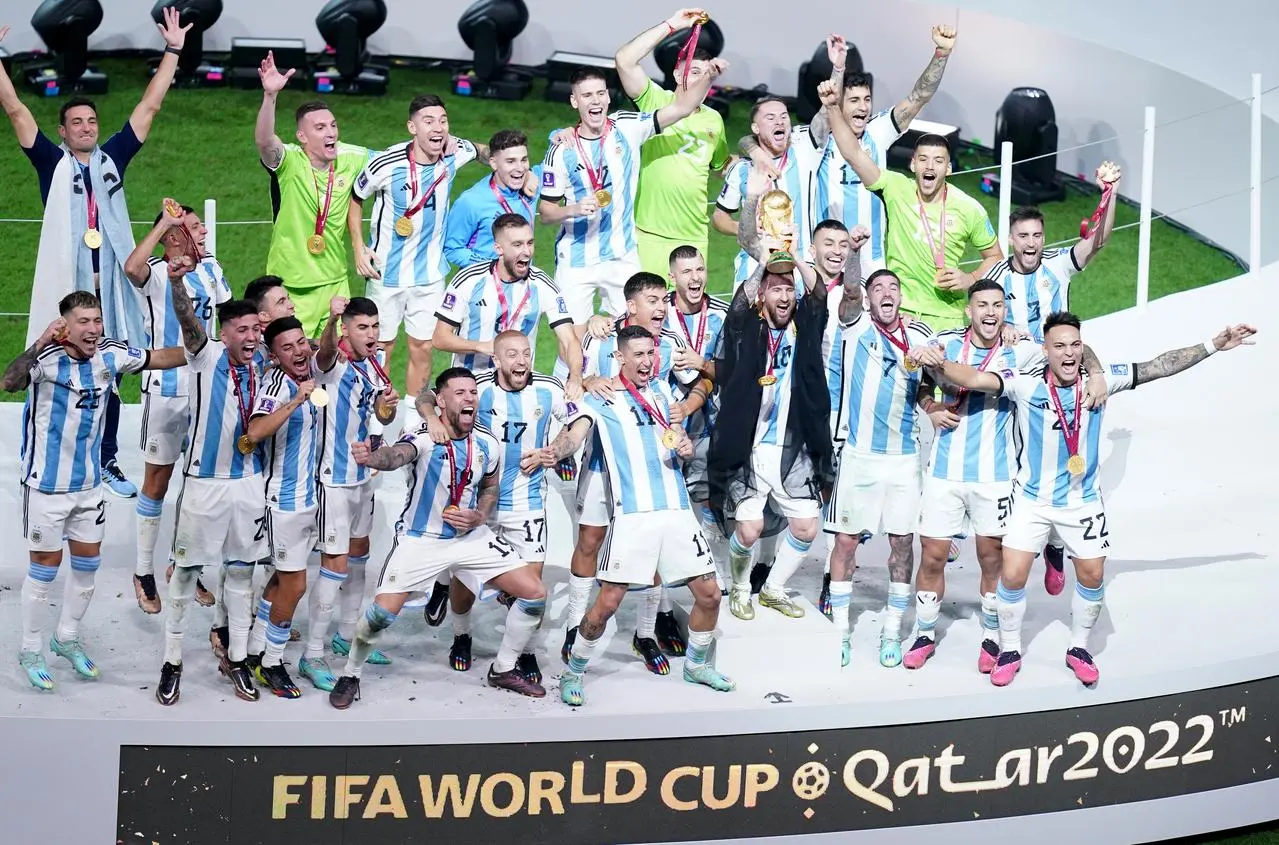 Argentina captain Lionel Messi lifts the FIFA World Cup trophy in December 2022
