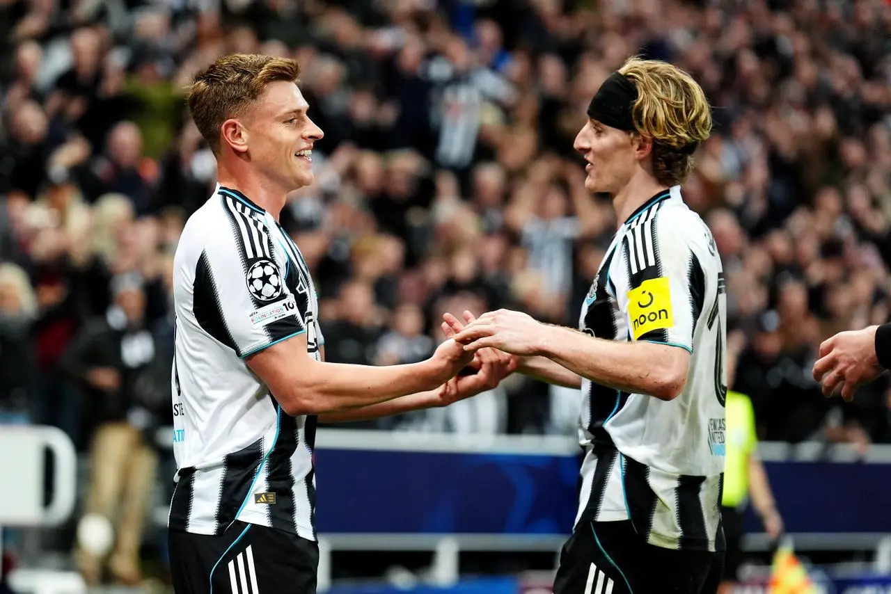 Harvey Barnes (left) celebrates with Anthony Gordon 