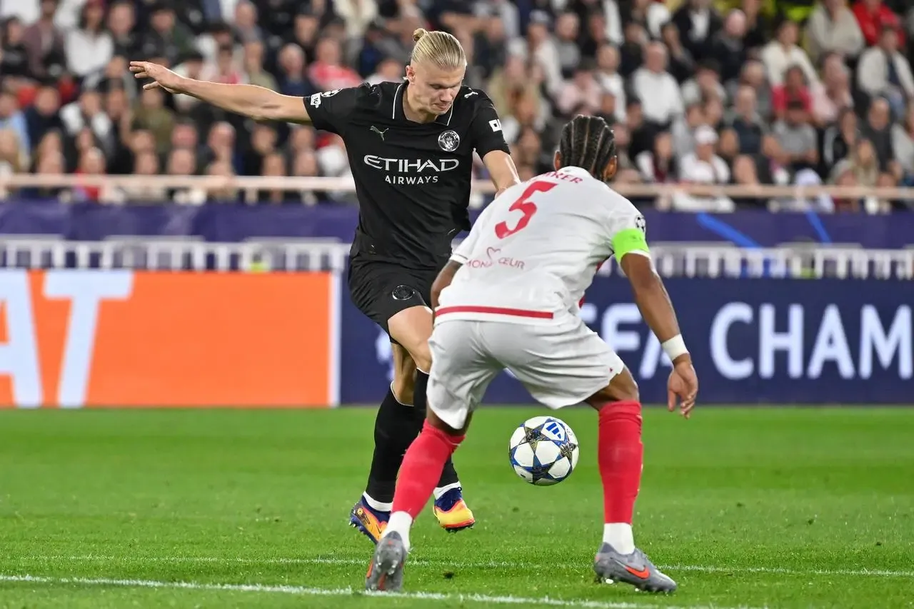 Manchester City’s Erling Haaland takes a shot at goal faced by Monaco's Thilo Kehrer
