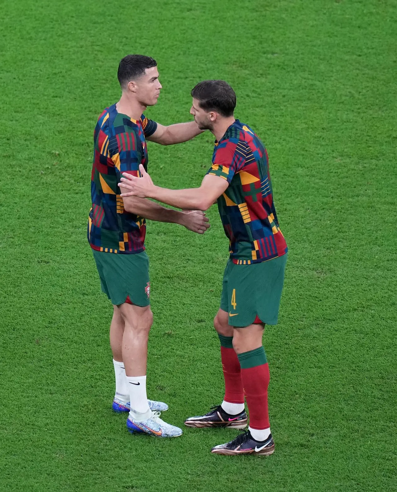 Portugal’s Ruben Dias (right) and Cristiano Ronaldo warm up before a World Cup match in Qatar