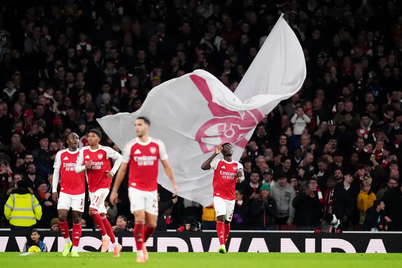 Arsenal’s Bukayo Saka (right) celebrates scoring