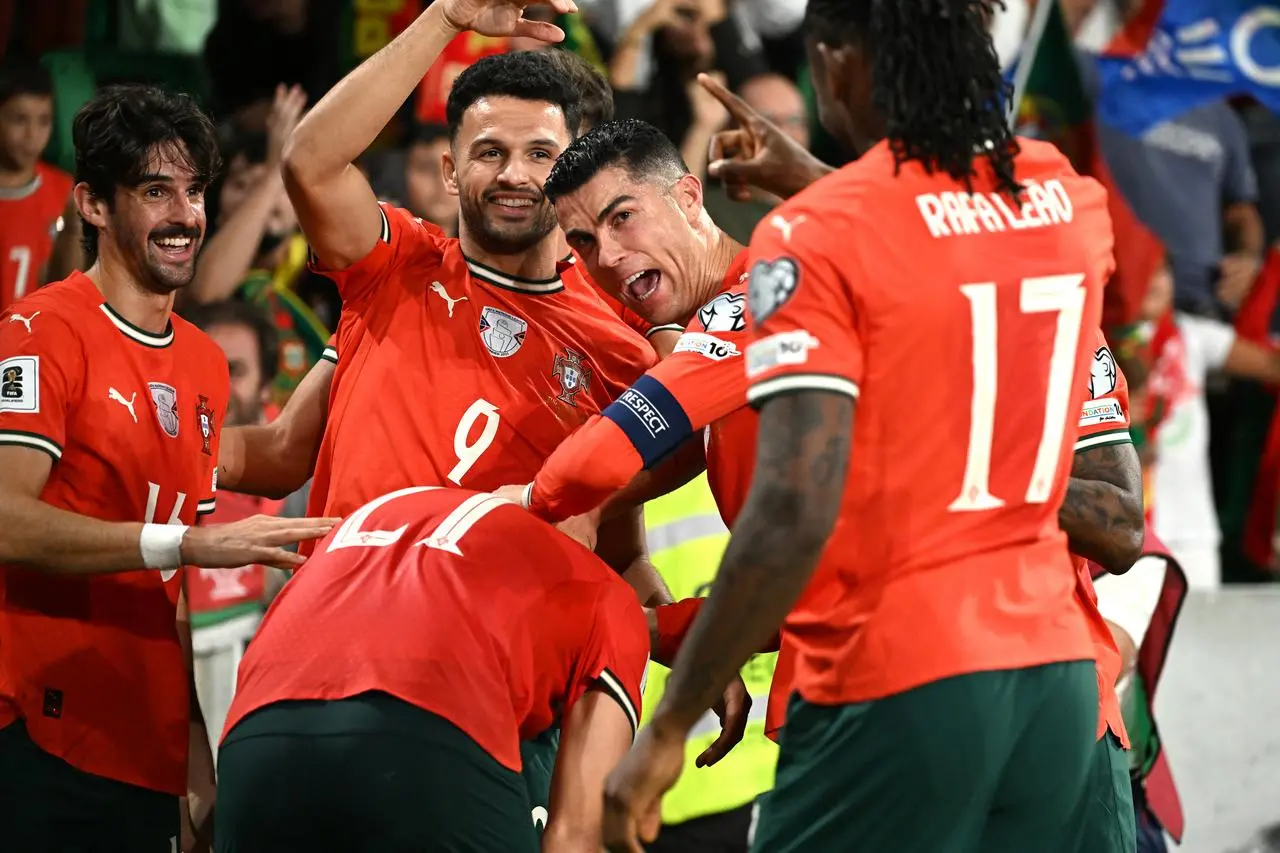 Portugal’s Ruben Neves (centre) celebrates scoring