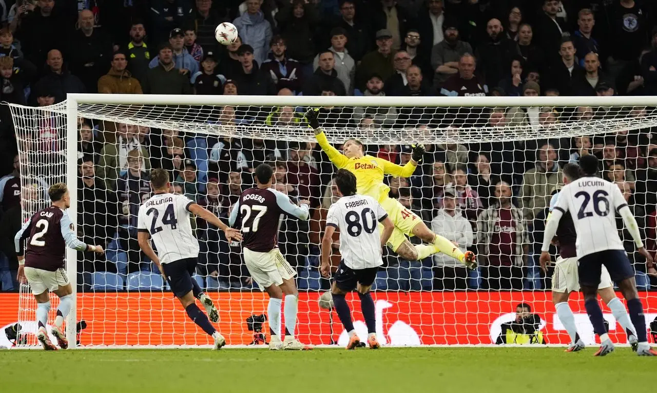 Marco Bizot saves a shot for Aston Villa against Feyenoord