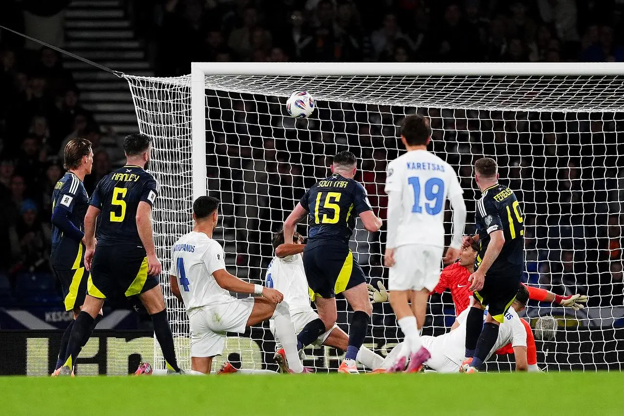 Lewis Ferguson (right) scores the second goal