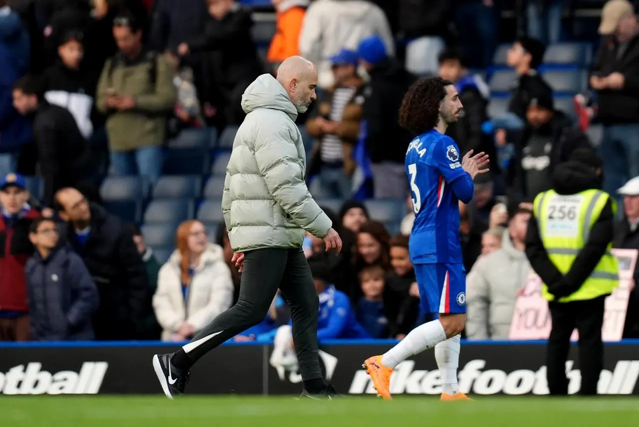 Enzo Maresca and Marc Cucurella walk off the pitch