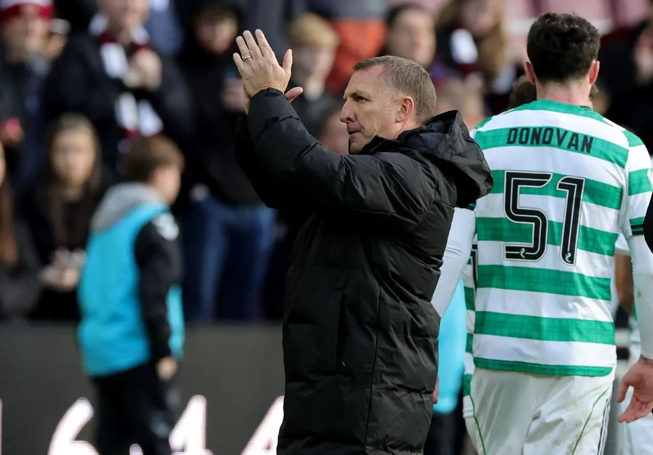 Brendan Rodgers applauds the fans after defeat at Tynecastle