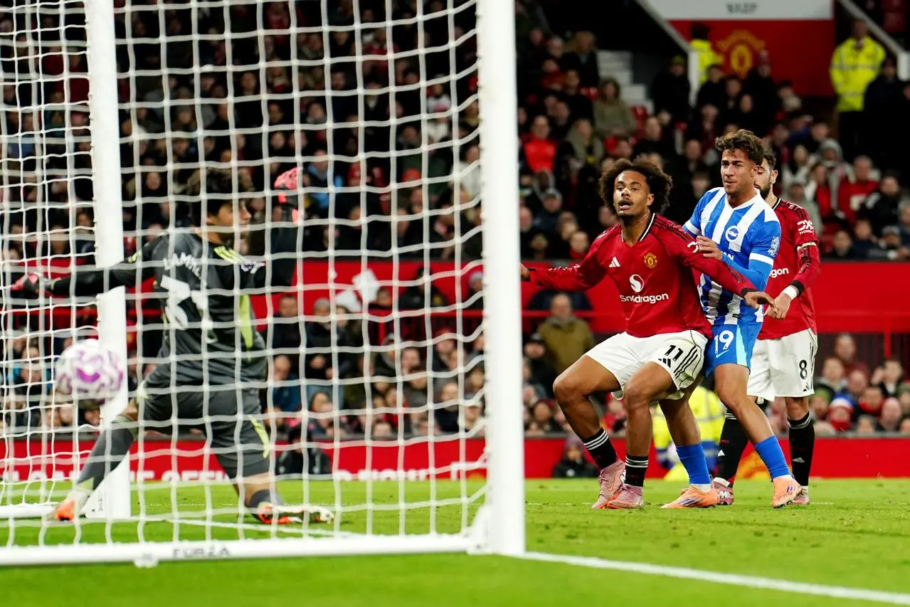 Charalampos Kostoulas heads the ball past Senne Lammens as Joshua Zirkzee looks on