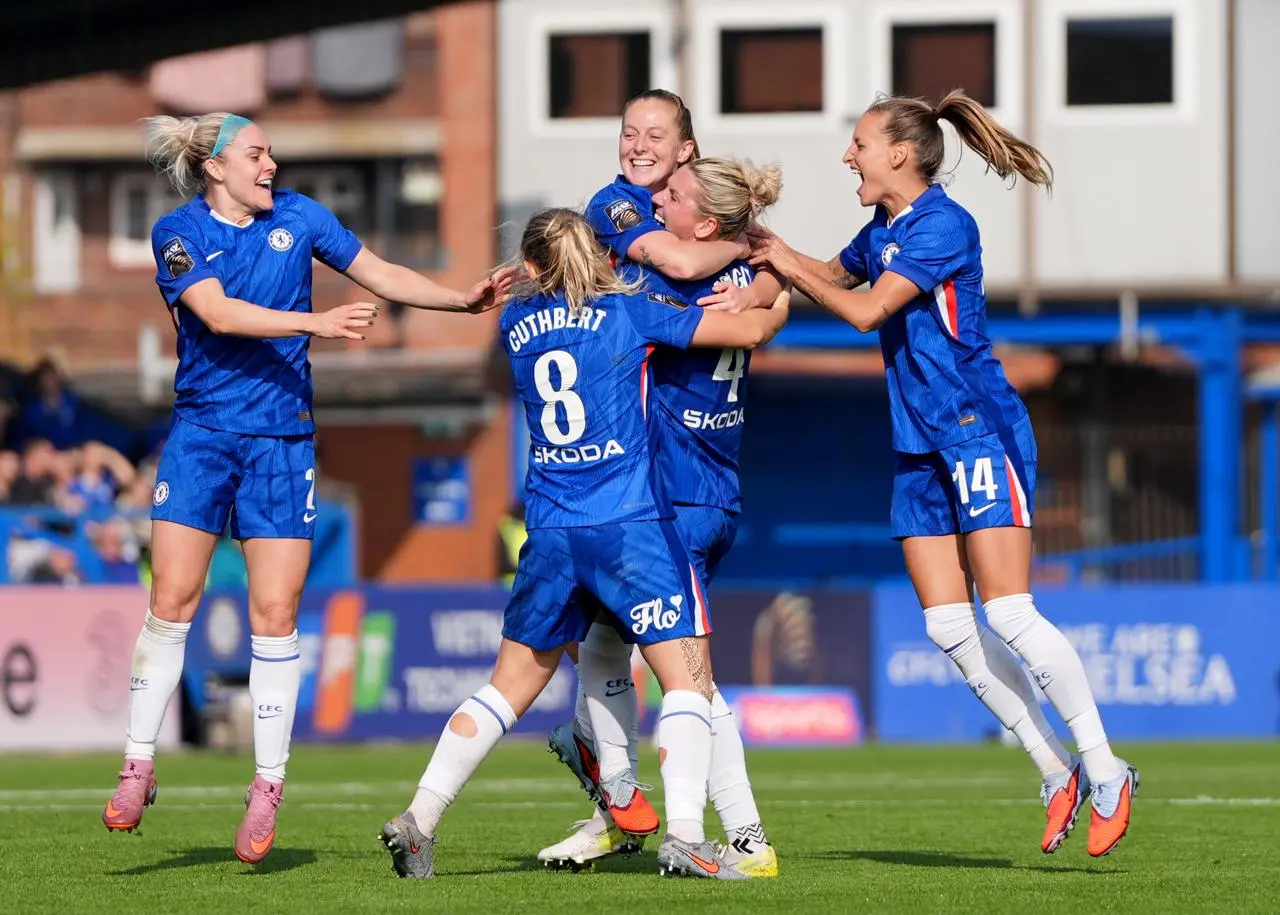 Chelsea’s Keira Walsh celebrates with her team-mates after scoring