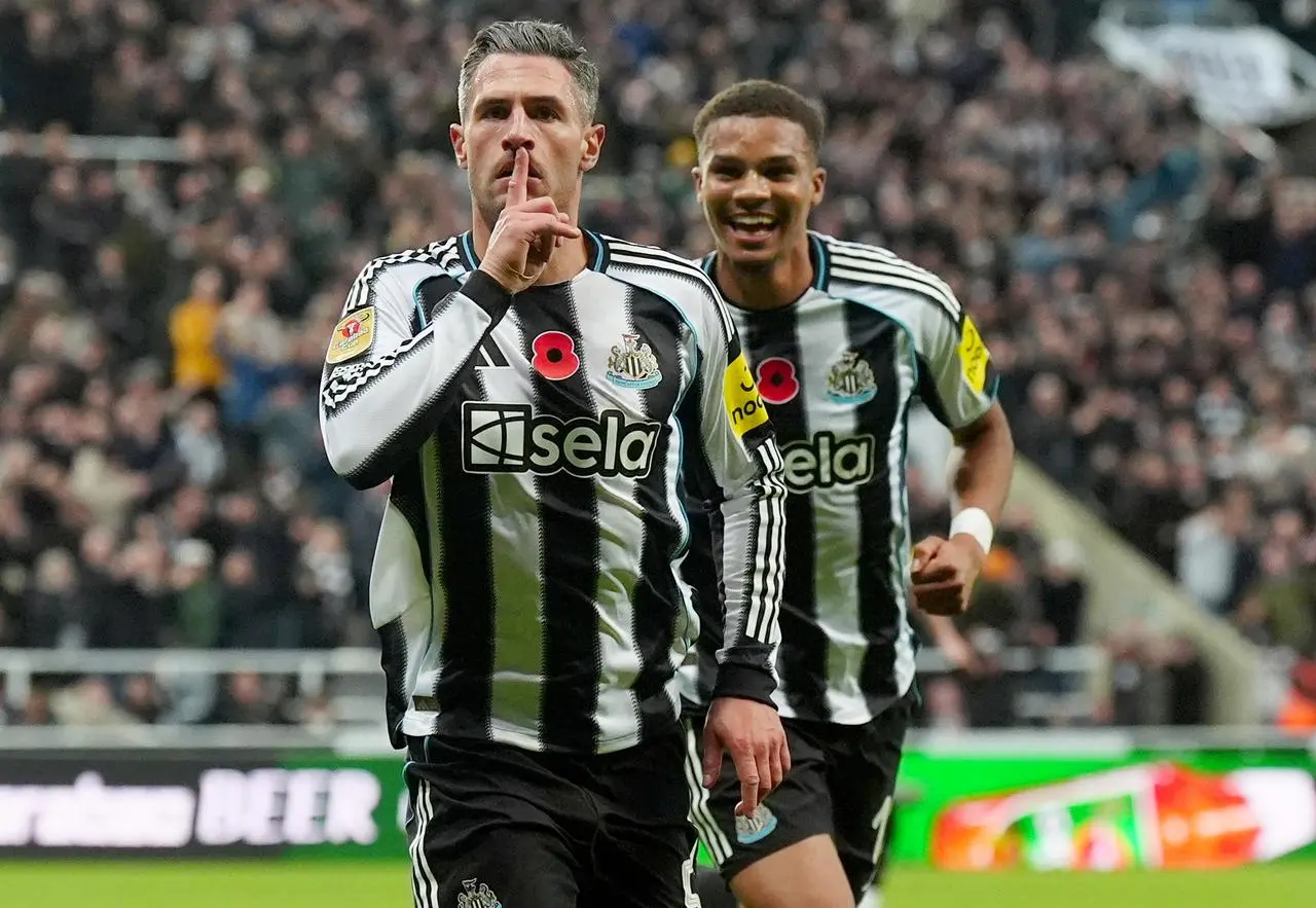 Newcastle United’s Fabian Schar (left) celebrates scoring