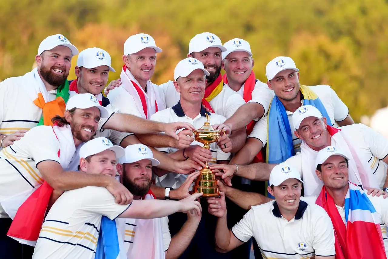 Team Europe players and captain Luke Donald (centre) with the Ryder Cup Trophy