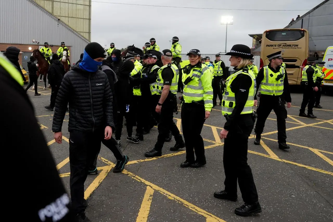 Rangers fans with police