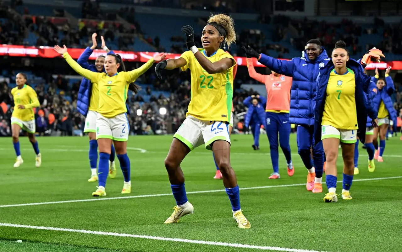 Brazil’s players celebrate after the game