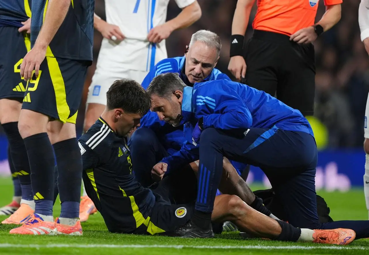 Aaron Hickey is treated by the physios
