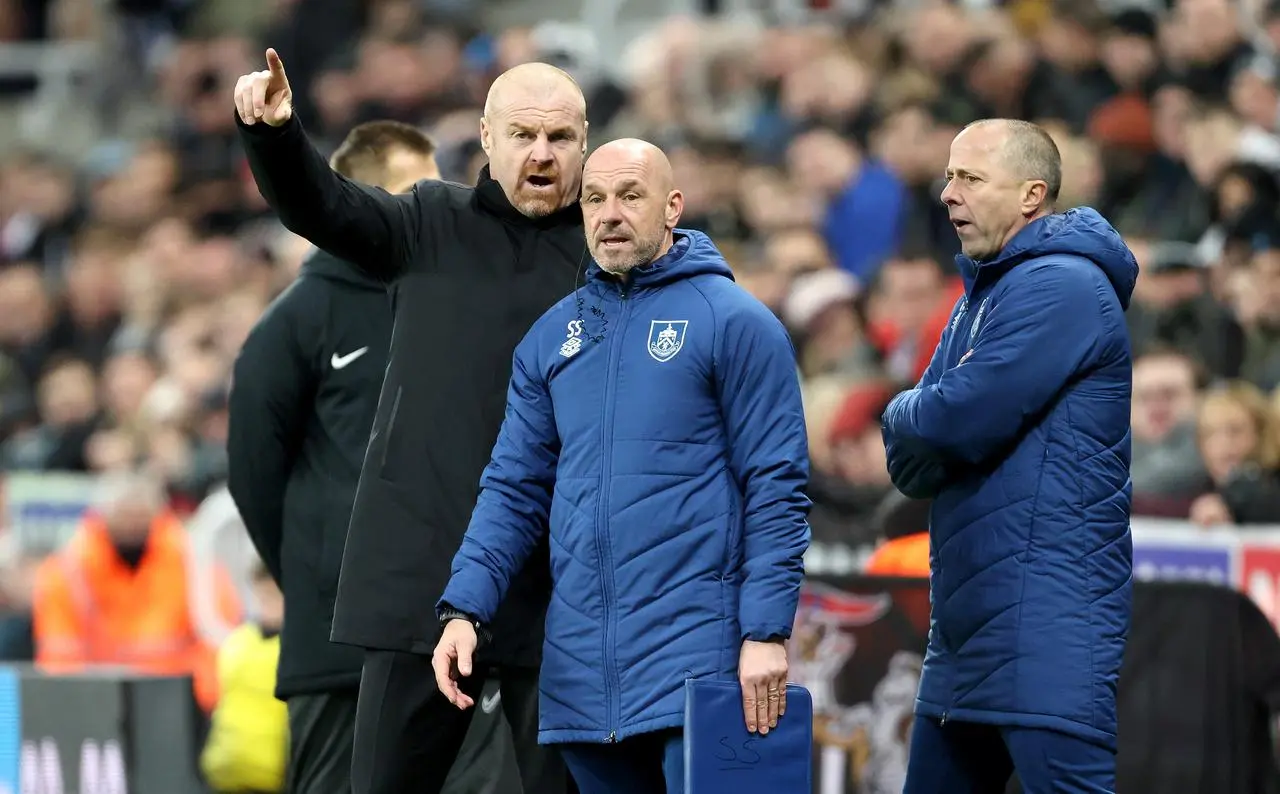 Sean Dyche, left, Steve Stone, center, and Ian Woan on the touchline