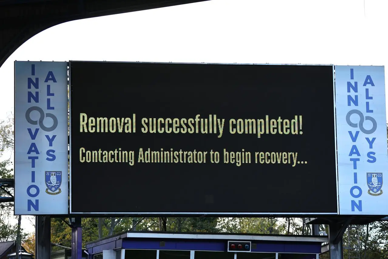 A large screen shows the text ‘Removal successfully completed! Contacting Administrator to begin recovery…’