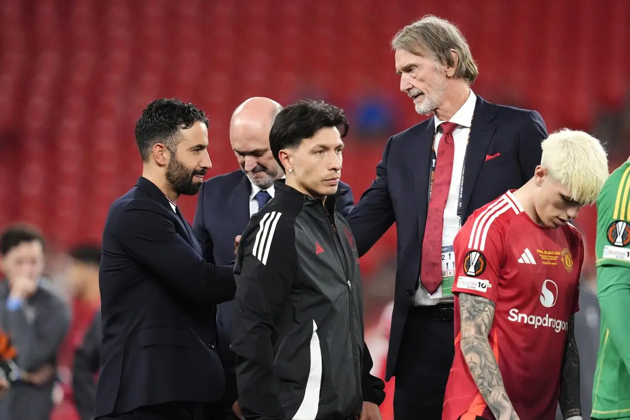 Manchester United head coach Ruben Amorim shakes hands with minority owner Sir Jim Ratcliffe 