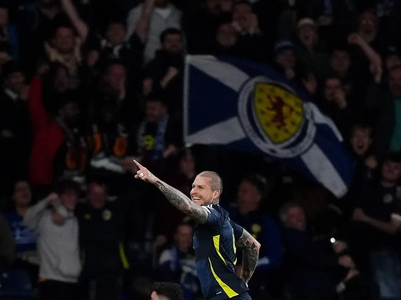 Scotland’s Lyndon Dykes celebrates scoring against Greece