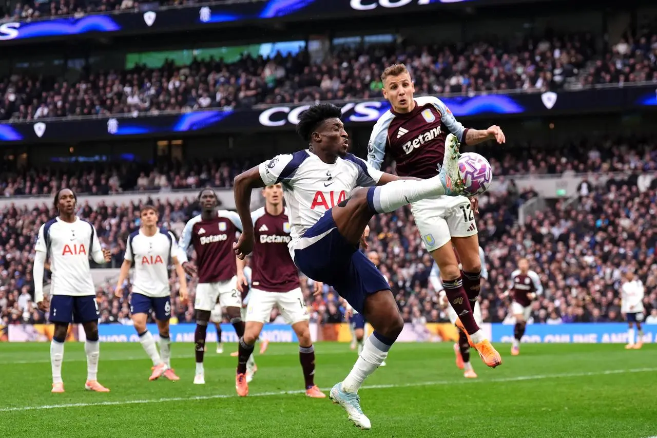 Tottenham Hotspur’s Mohammed Kudus (left) and Aston Villa’s Lucas Digne battle for the ball