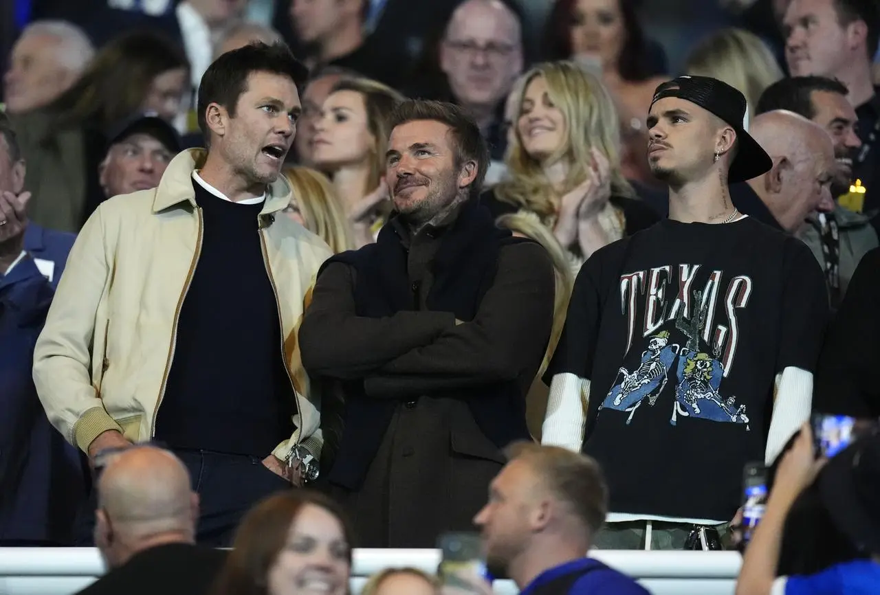 Tom Brady, left, pictured with David Beckham at the Birmingham v Wrexham League One match