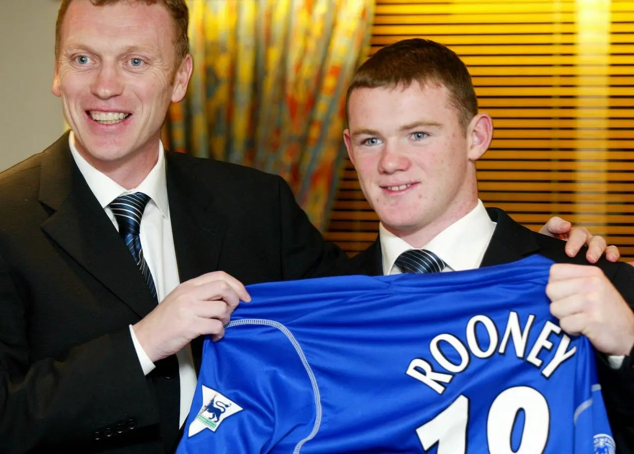 Wayne Rooney poses with David Moyes after signing a contract at Everton