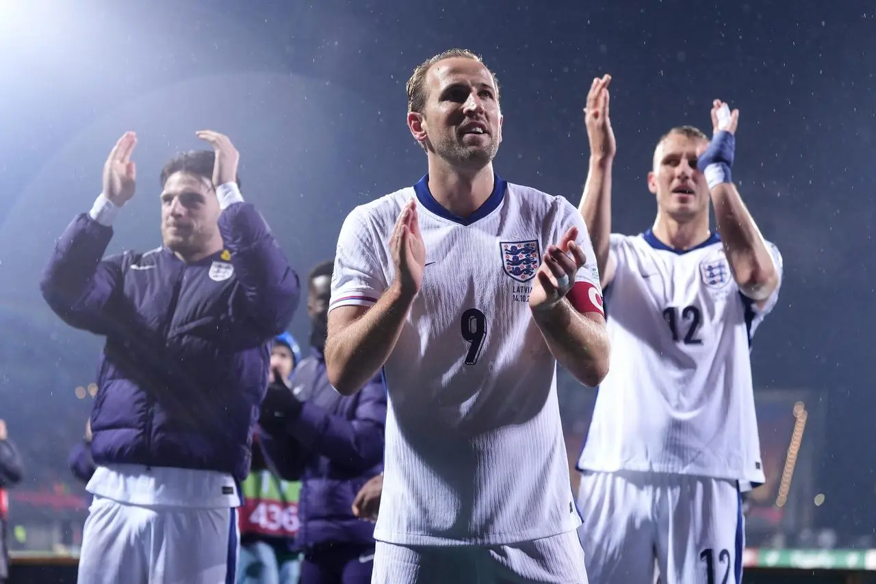 England’s Harry Kane (centre) and team-mates applaud the fans following victory in the FIFA World Cup European Qualifying match in Riga