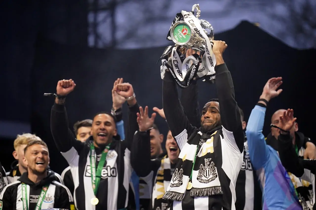 Newcastle striker Callum Wilson on stage with the Carabao Cup during a celebratory parade