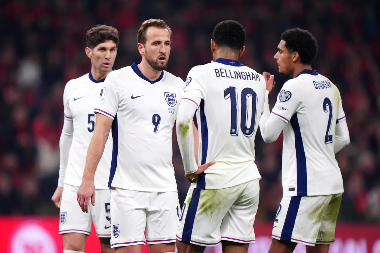 England’s Harry Kane celebrates with team-mates after his second goal