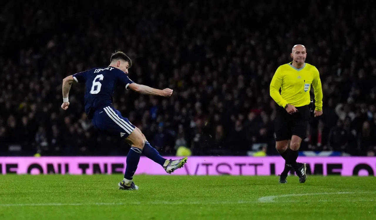Kieran Tierney guides a shot into the corner