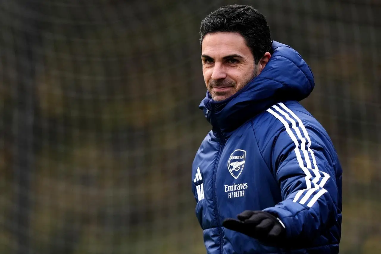 Mikel Arteta smiles