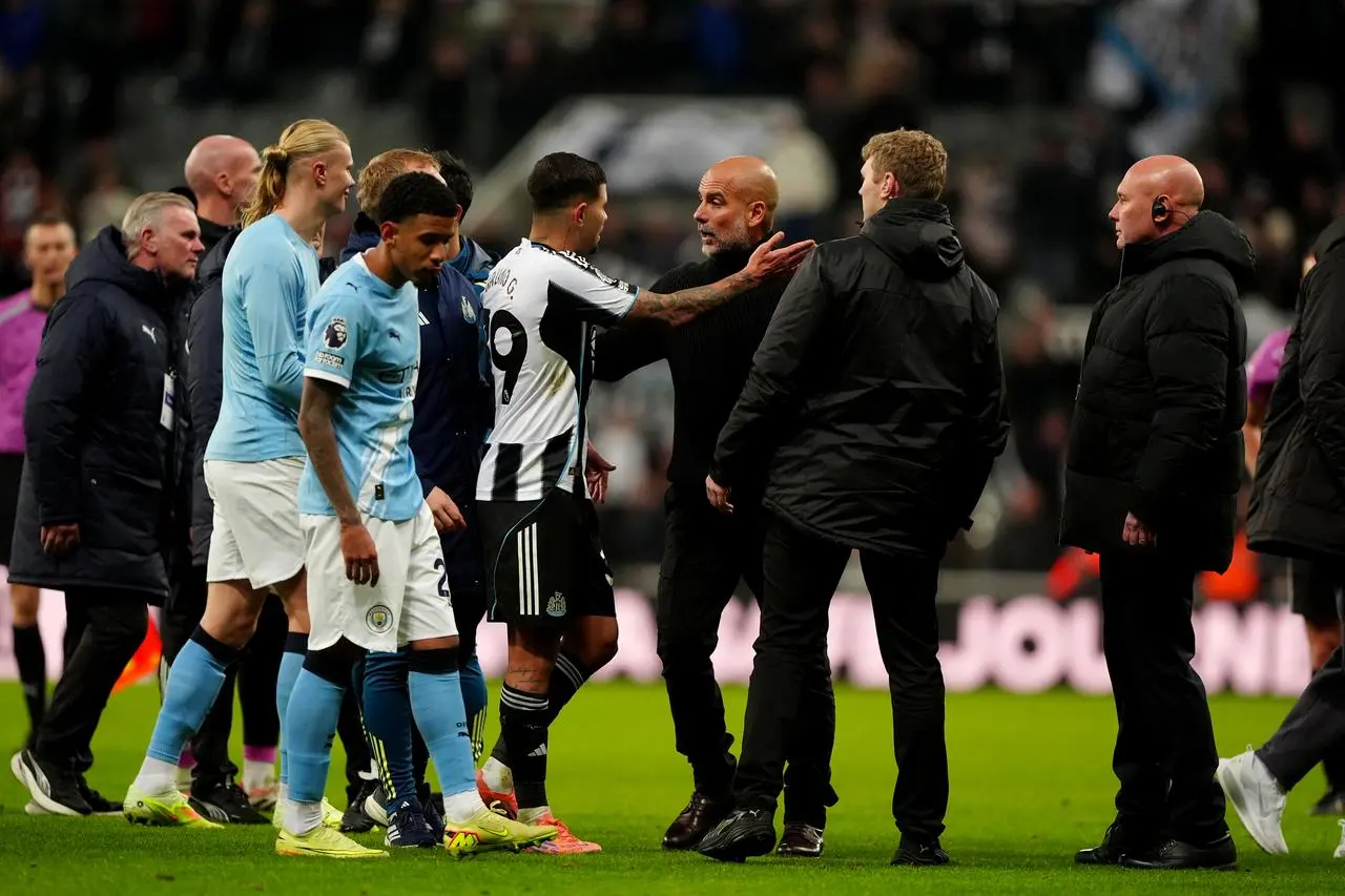 Newcastle’s Bruno Guimaraes (centre left) and Manchester City manager Pep Guardiola (centre right) speak after the match